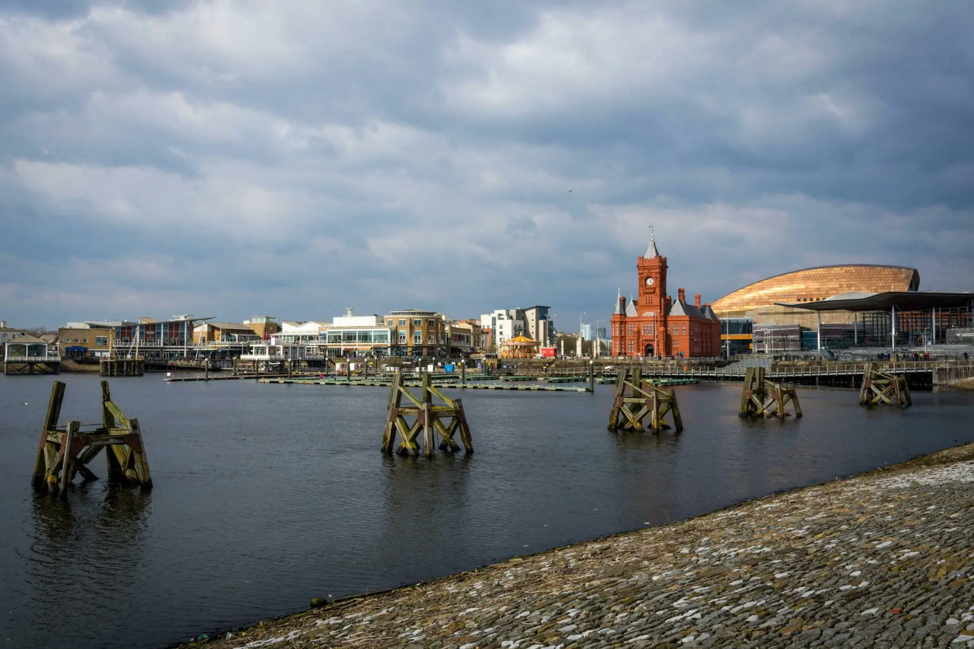 Cardiff Bay waterfront with the red-brick Pierhead Building and the Wales Millennium Centre