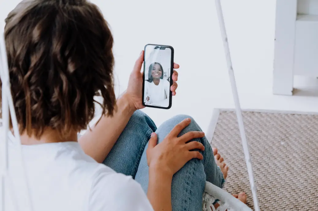 person staying in touch with relative via facetime person staying in touch with relative via facetime