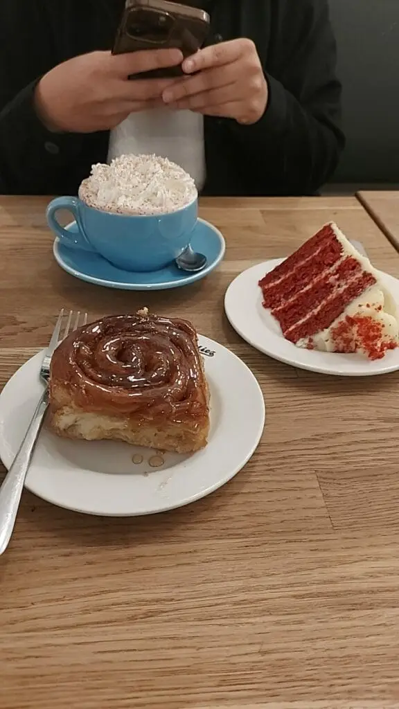 cinnamon roll, cake, hot chocolate