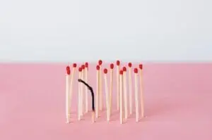 Matchsticks on Pink Surface