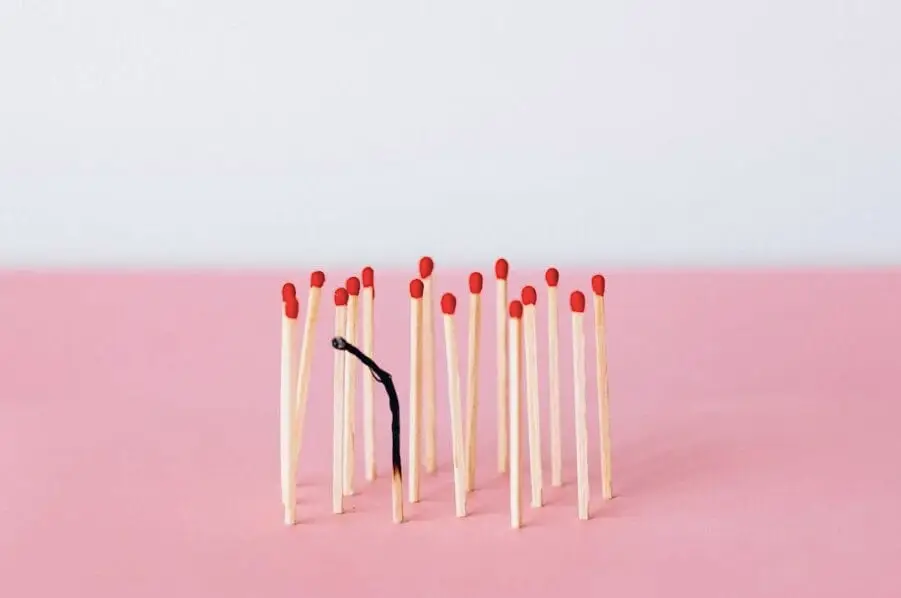 Matchsticks on Pink Surface