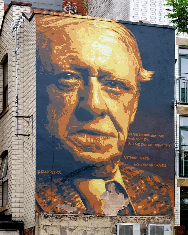 Portrait of Anthony Burgess on wall - University of Manchester famous alumni