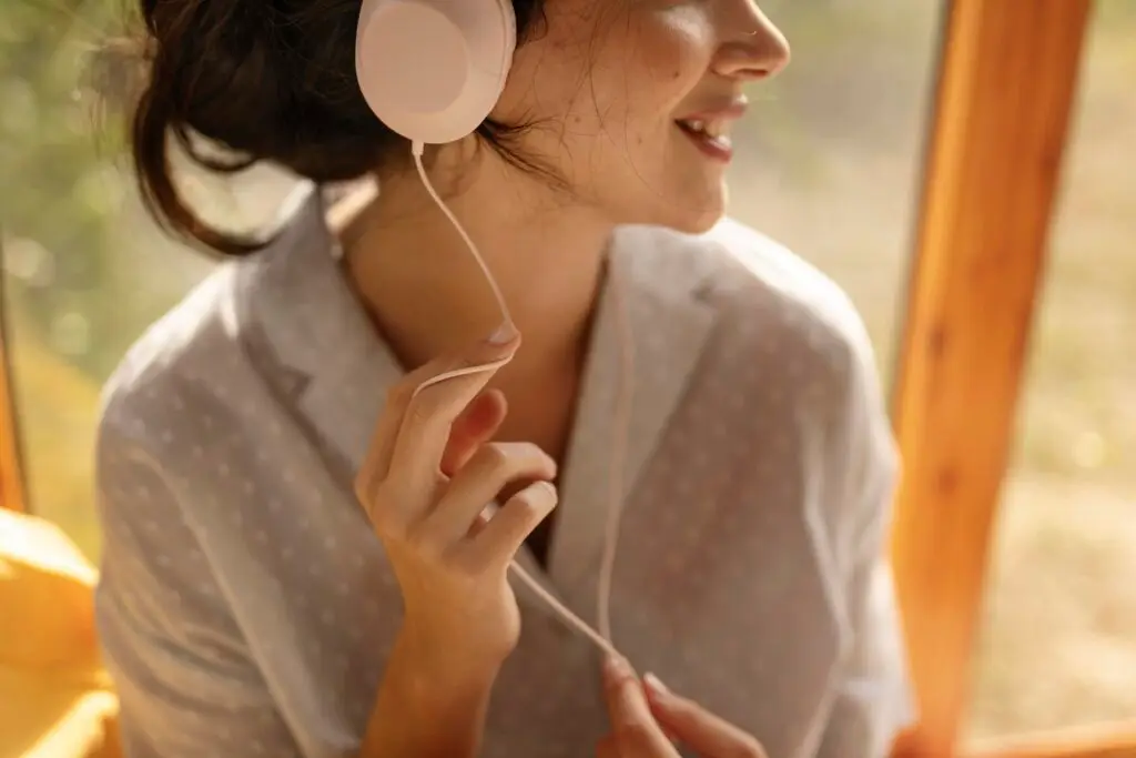 Woman wearing noise-cancelling headphones close up