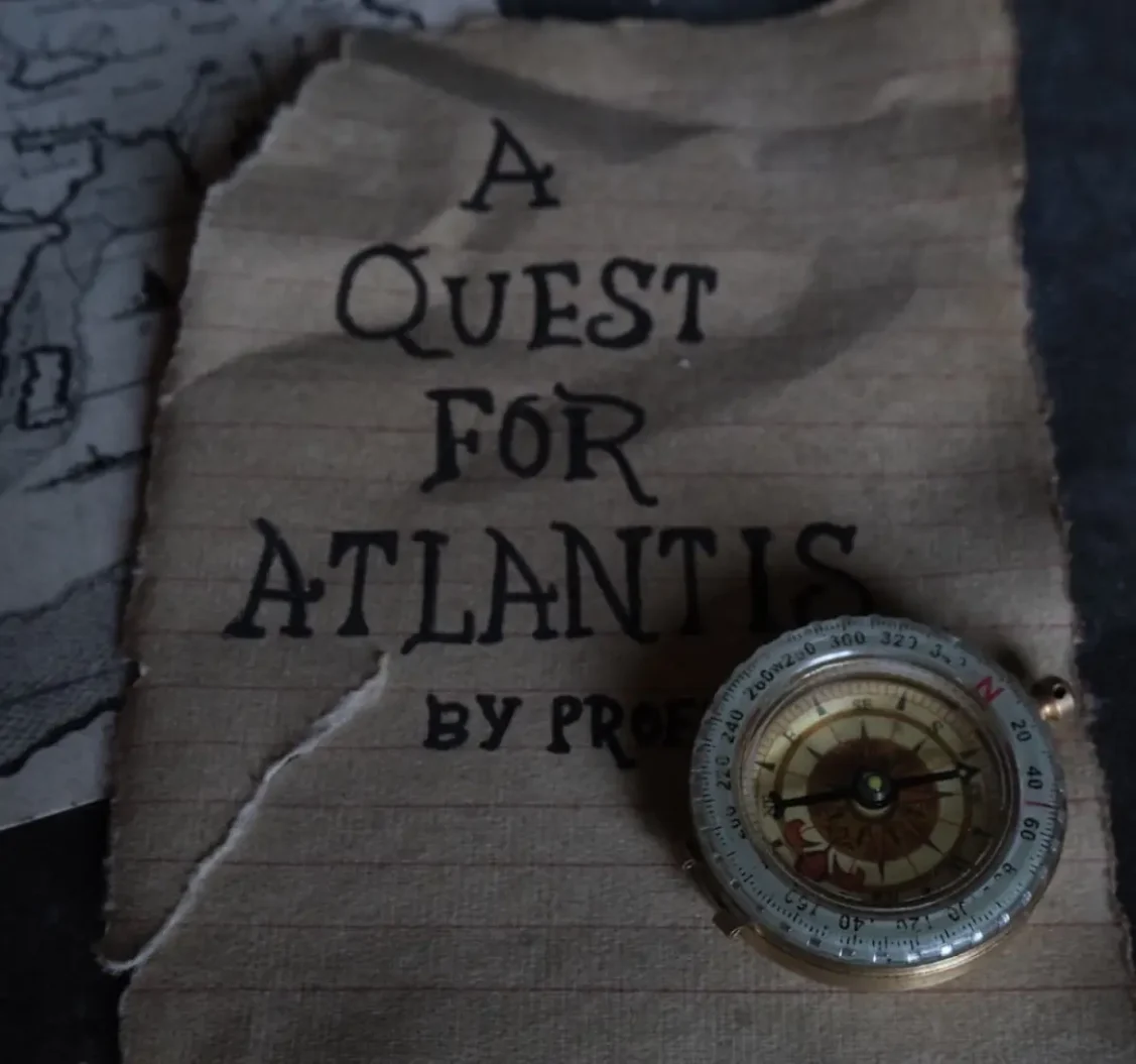 Quest For Atlantis Escape Room sign