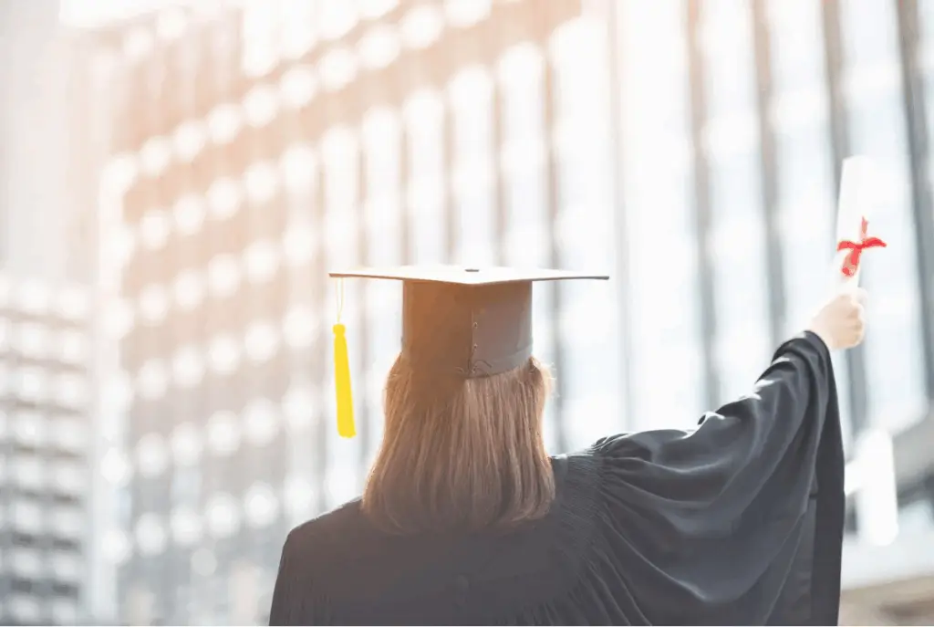 graduate holding a scroll