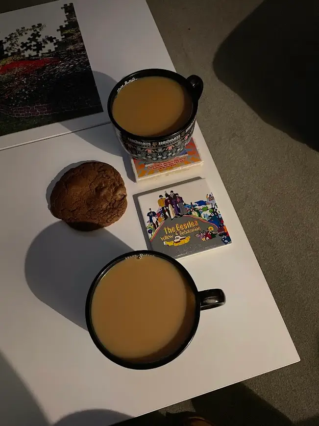 Two cups of tea and a homemade chocolate cookie