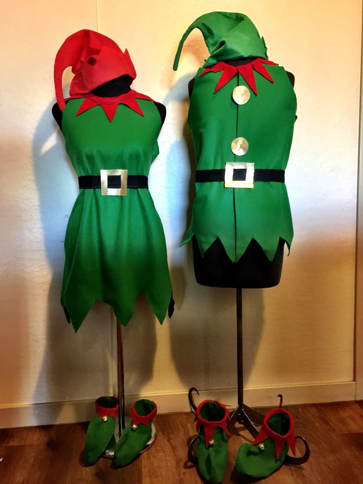 two green elf costumes with red and black DIY