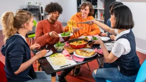 students eating and living together
