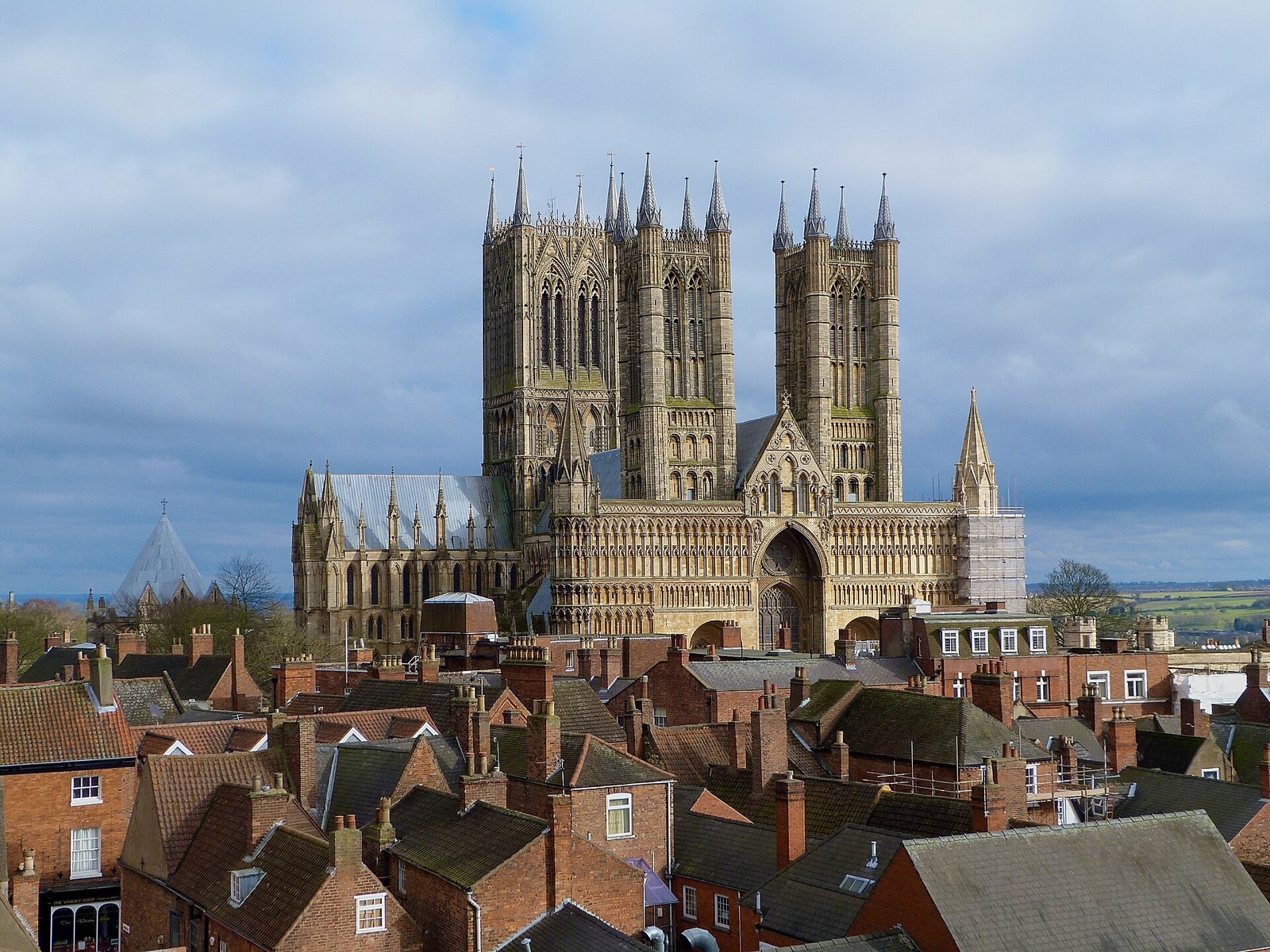 Lincoln Cathedral towering over the red rooftops of the city, seen from Lincoln Castle