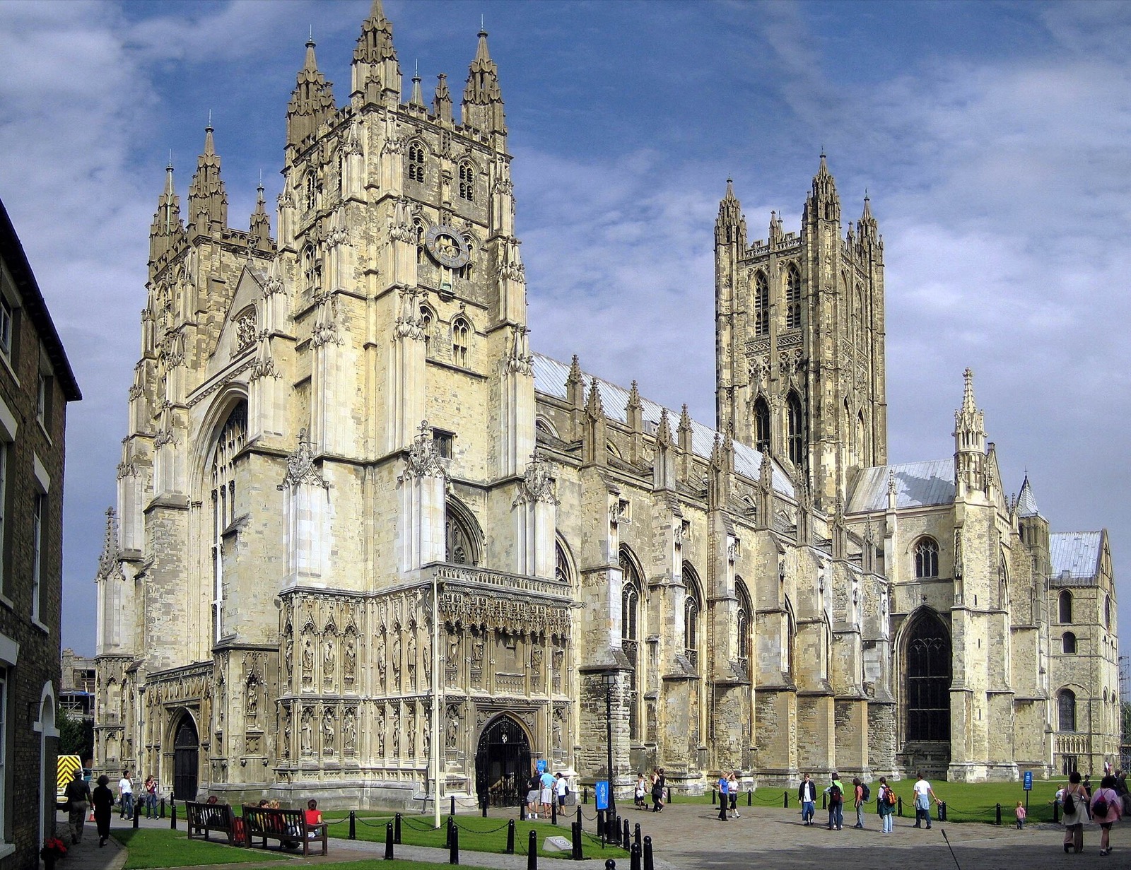 Canterbury Cathedral's Bell Harry Tower and west front under a blue sky