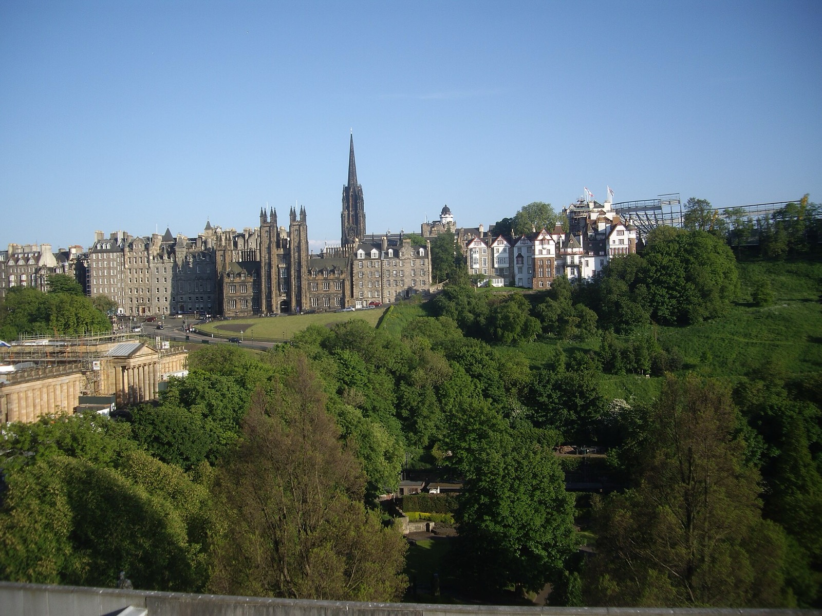 Edinburgh's Old Town skyline rising above the greenery of Princes Street Gardens