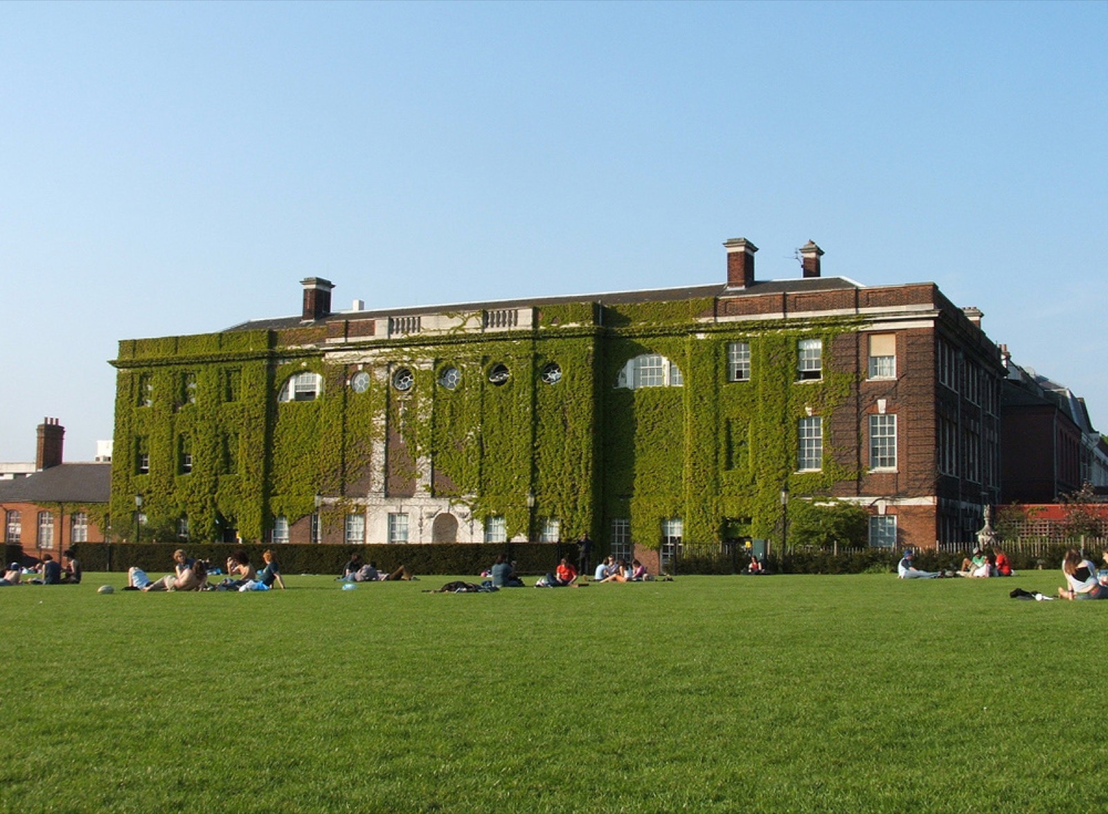 Goldsmiths' ivy-clad Richard Hoggart Building seen across the green in New Cross