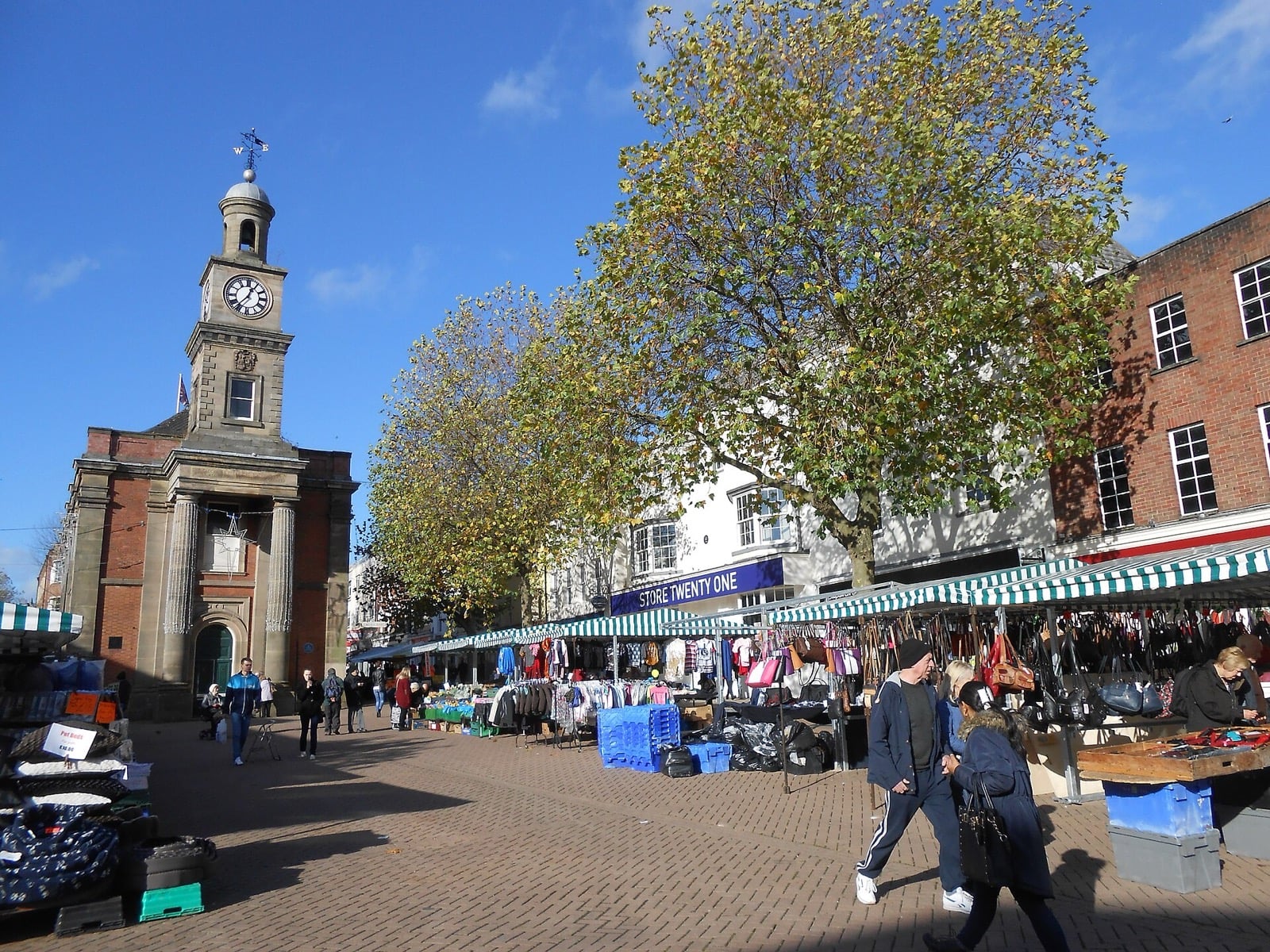 Market stalls on the High Street in Newcastle-under-Lyme with the Guildhall clock tower