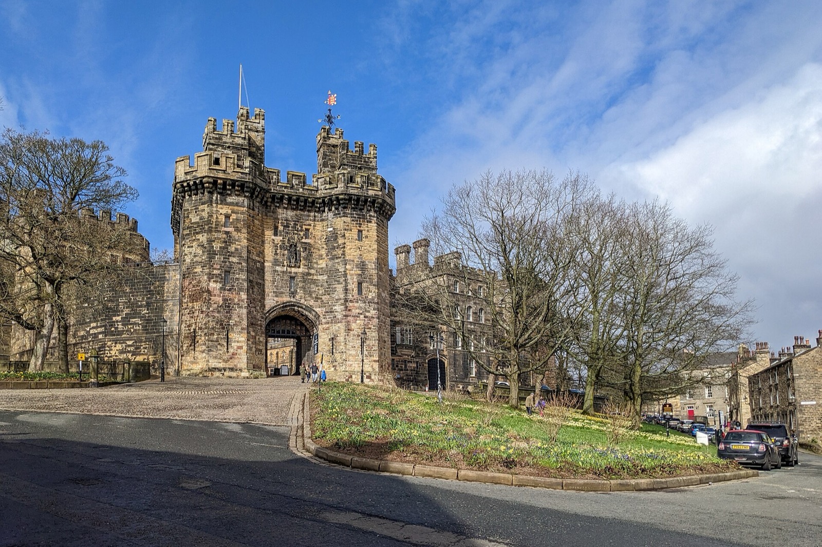 The gatehouse of Lancaster Castle under a blue sky