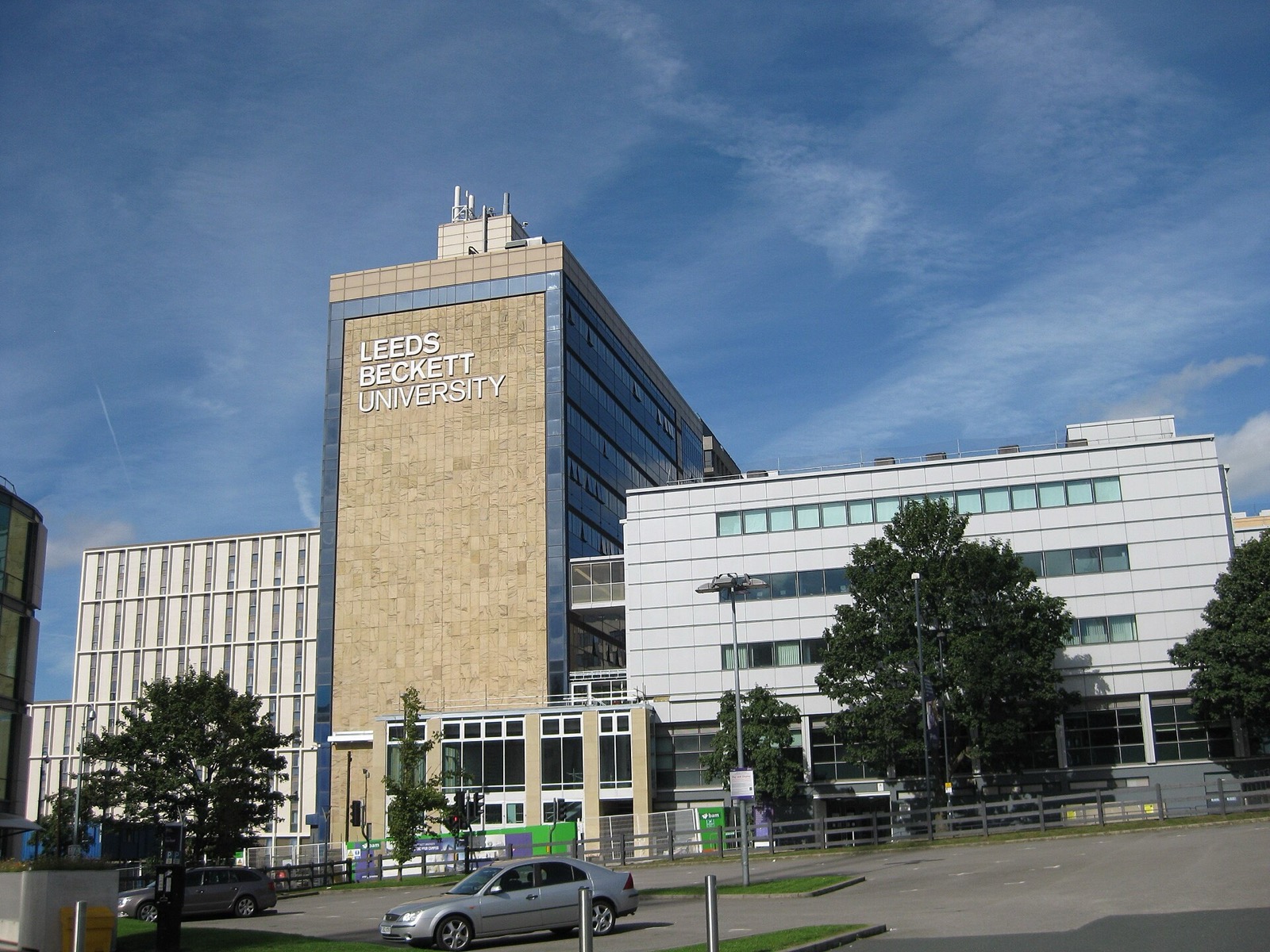 Leeds Beckett University's City Campus tower and buildings under a blue sky