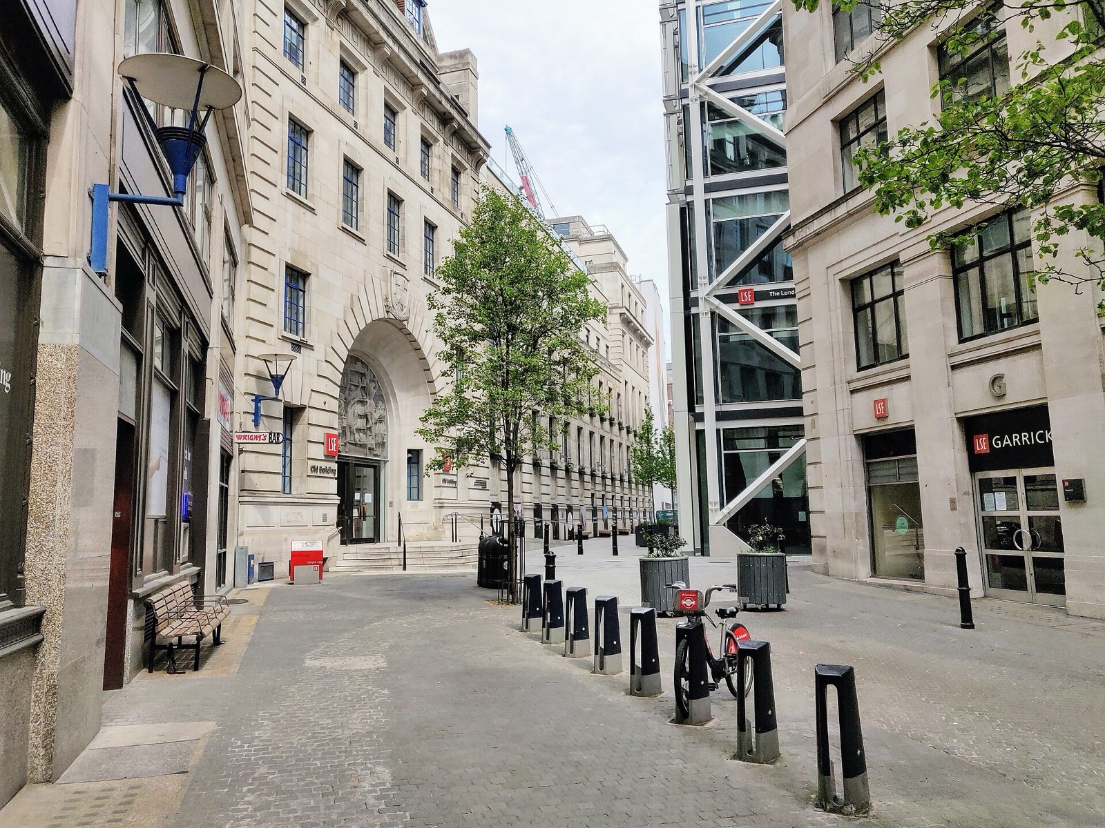 Houghton Street lined with London School of Economics buildings, seen from Aldwych