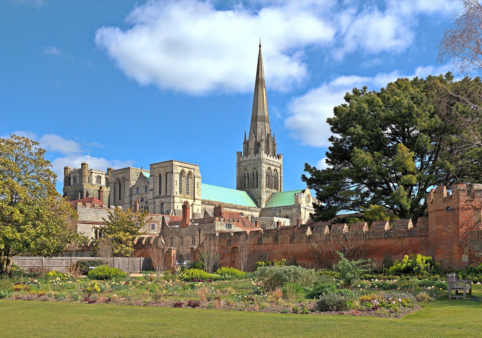 Chichester Cathedral spire above the city walls and gardens