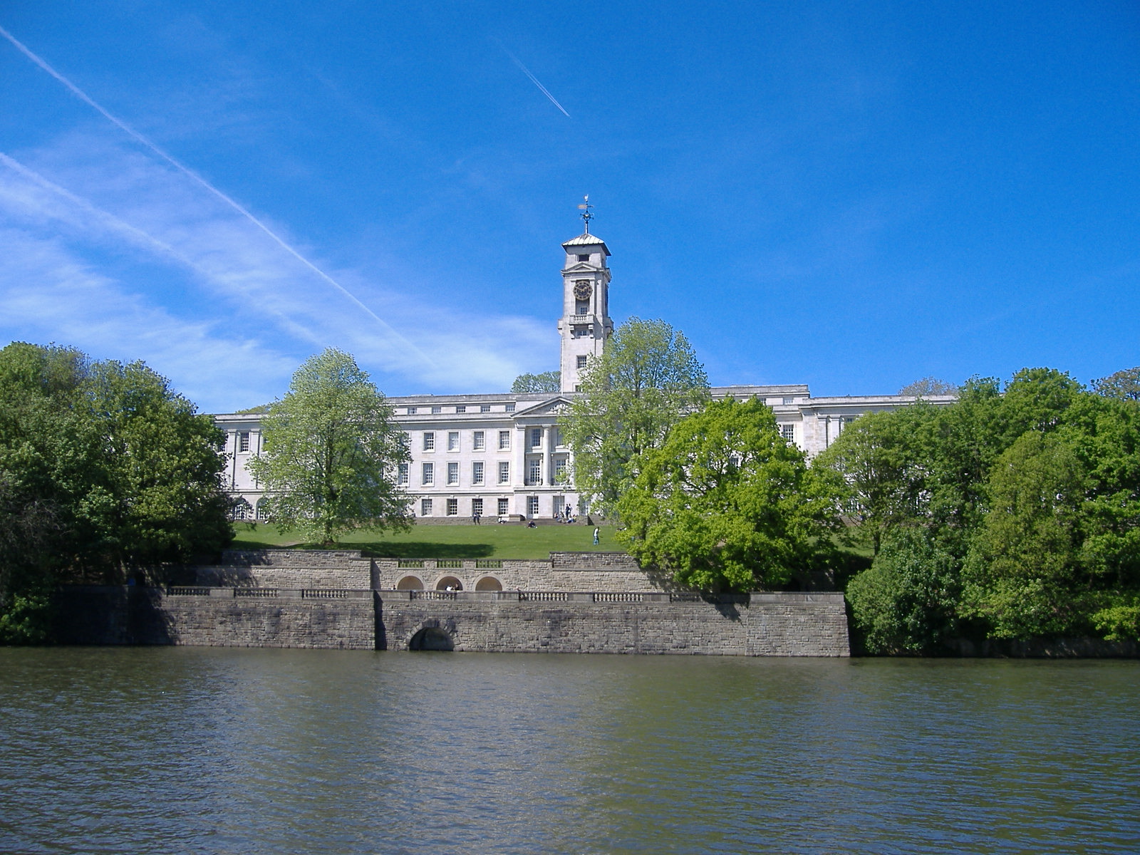 The Trent Building clock tower above the lake at University Park, Nottingham