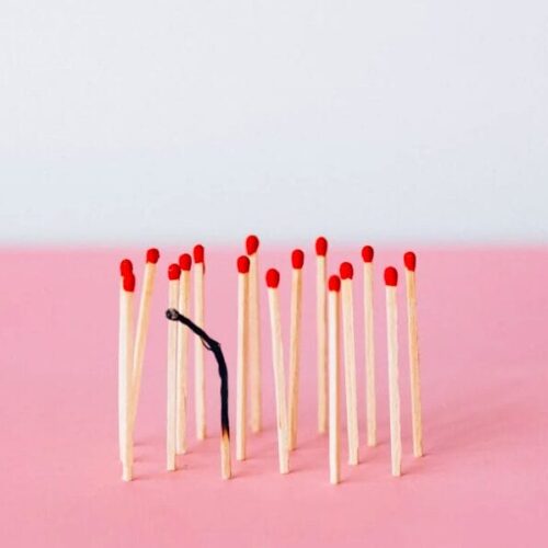 Matchsticks on Pink Surface